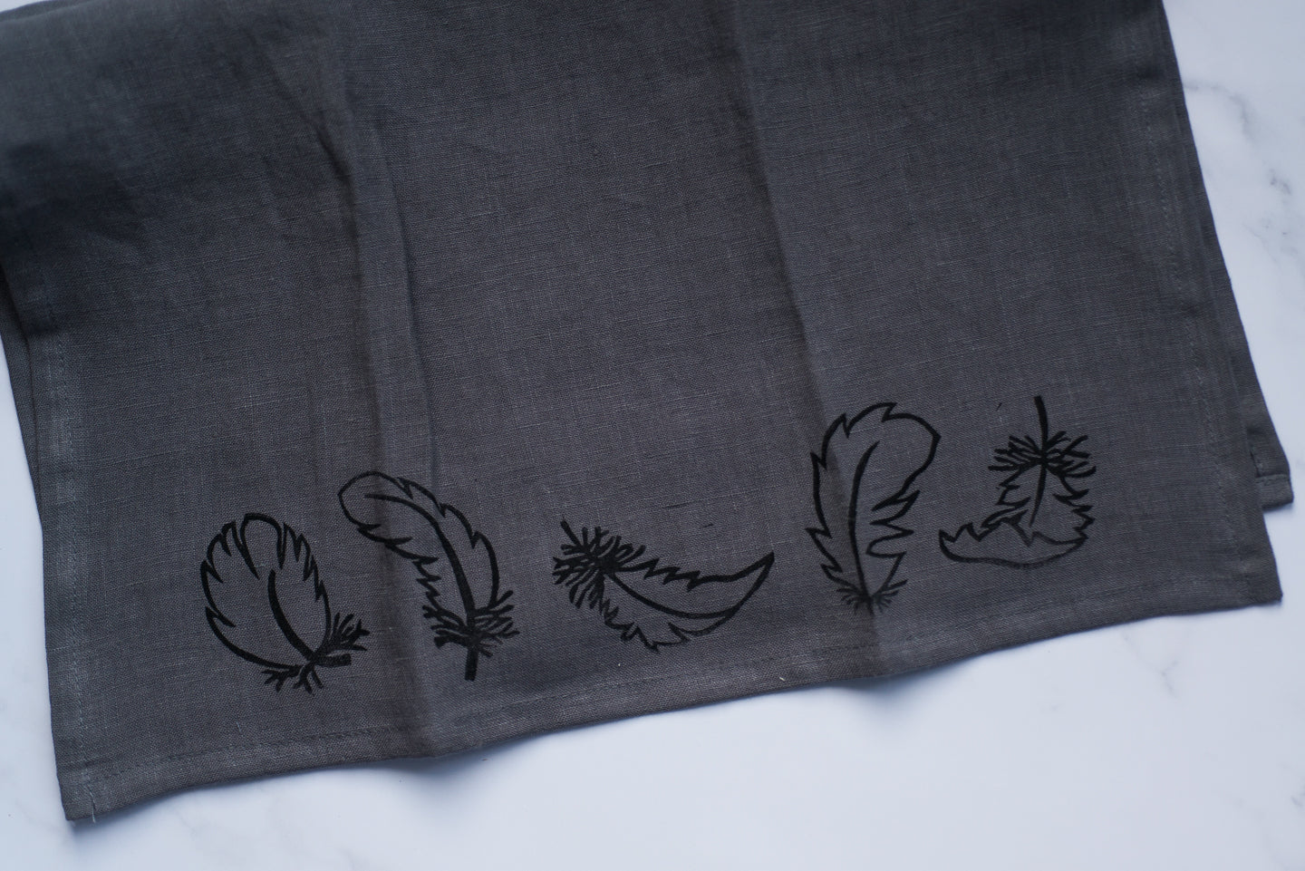 Organic linen tea towel - falling feathers